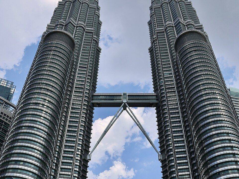 The Petronas Twin Towers seen from below, with the skybridge linking the two towers