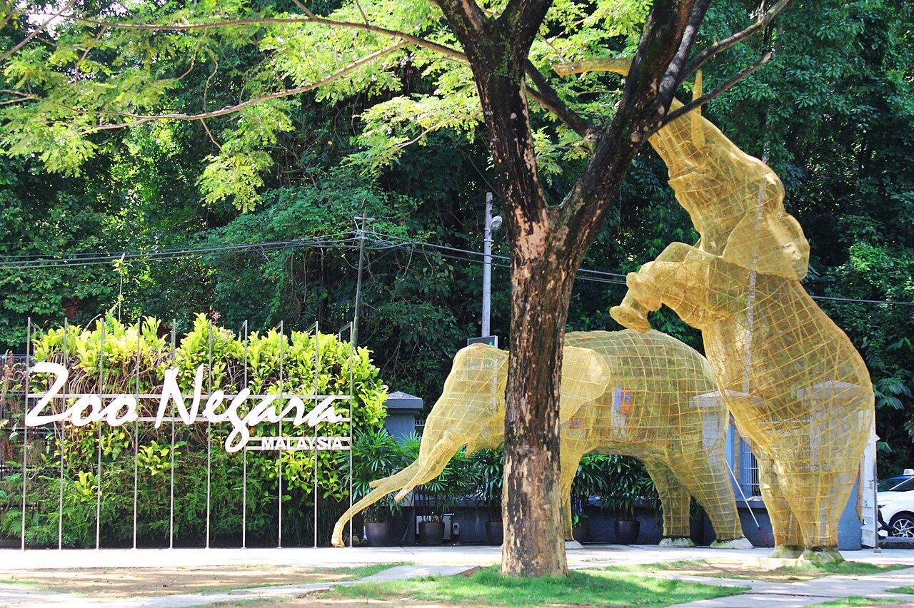 The entrance to Zoo Negara in Kuala Lumpur, with an elephant sculpture above the gate