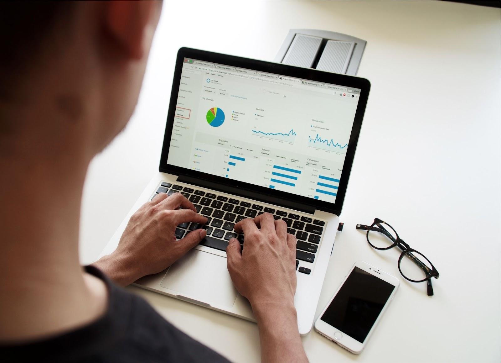 Person using MacBook Pro | SEO In house vs Outsourcing | One Search Pro Marketing
